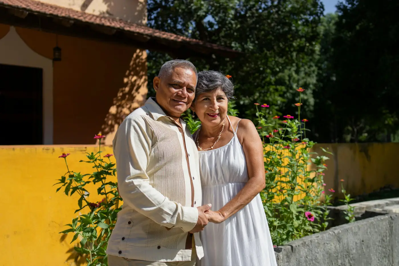 An older couple together at home.
